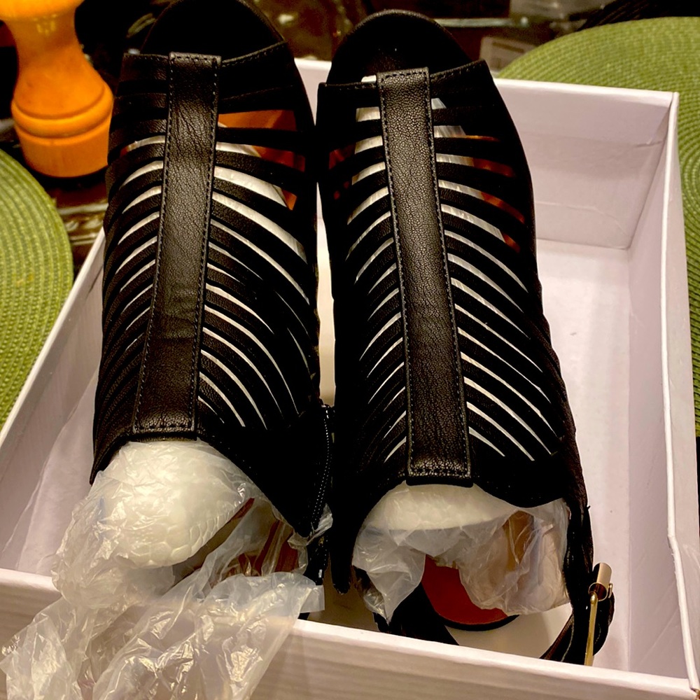 Black strappy dress sandals-Never worn. Size 7.  No tags.Has original packaging